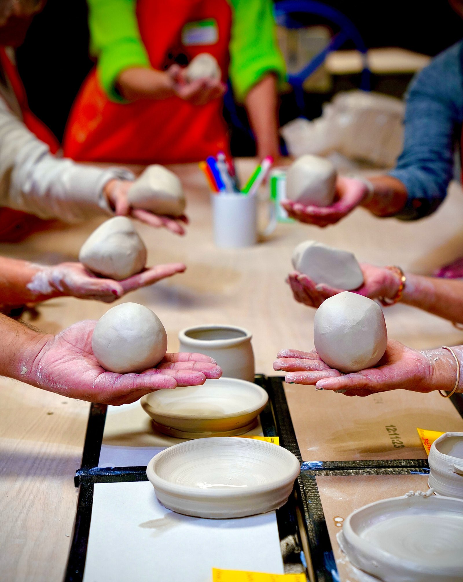 High angle view of colorful painted pottery pieces on display