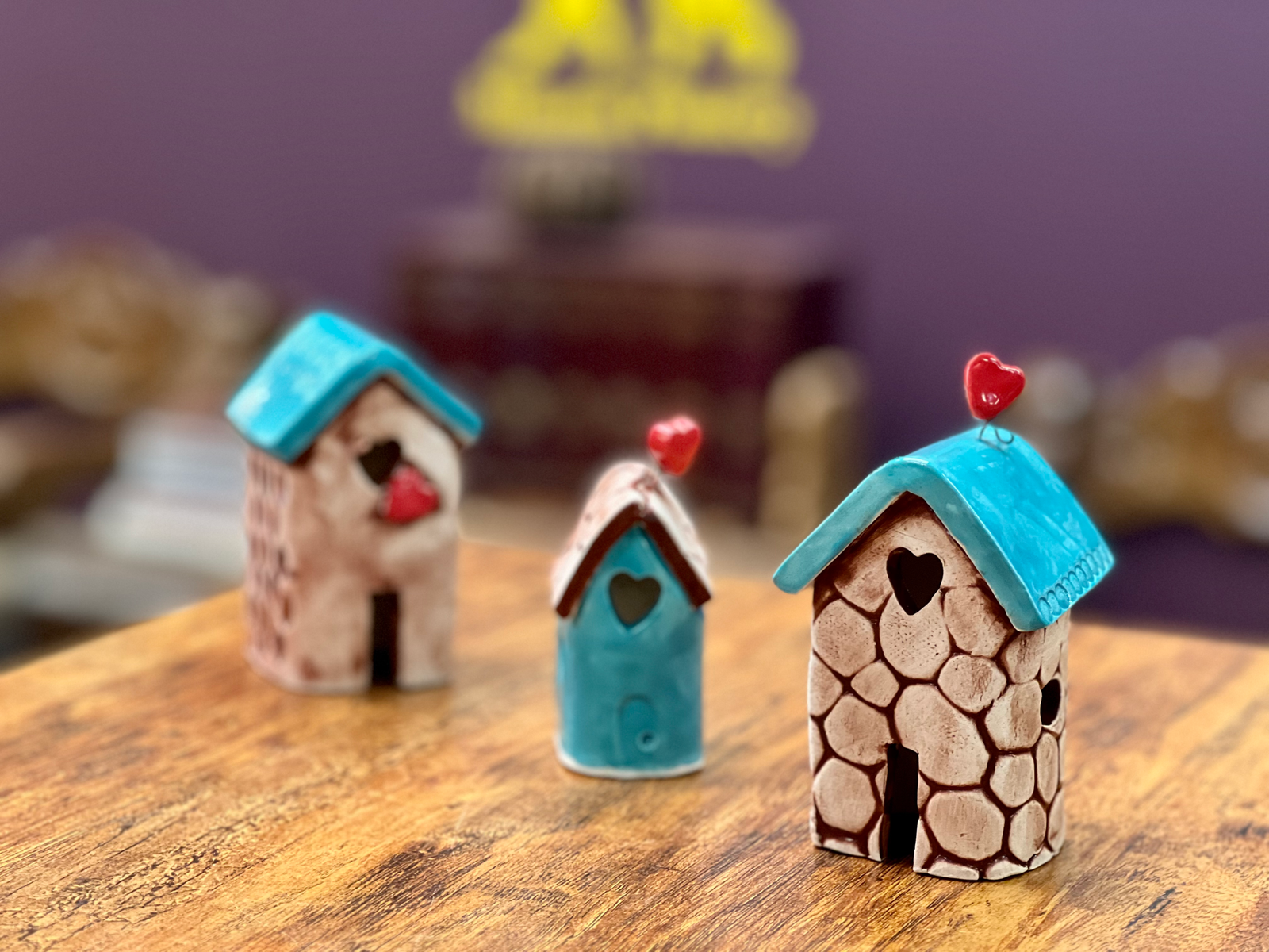 Eye-level view of a ceramic mug decorated with colorful hand-painted floral designs
