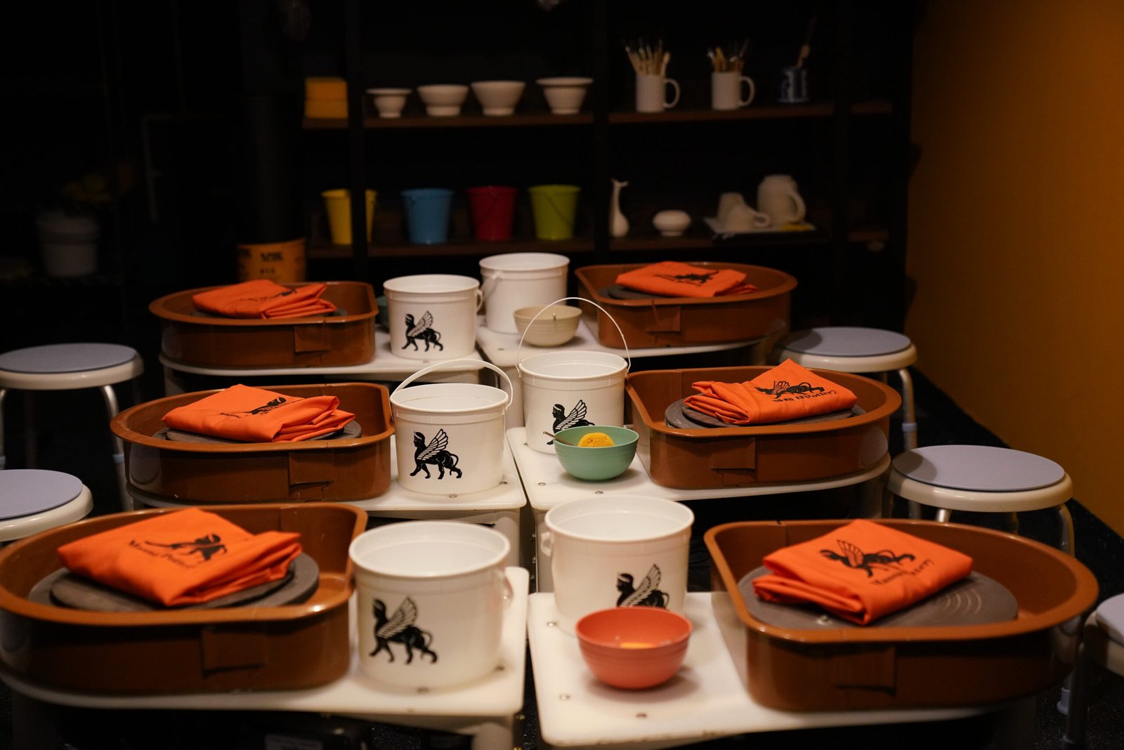 High angle view of pottery tools arranged neatly on a wooden table